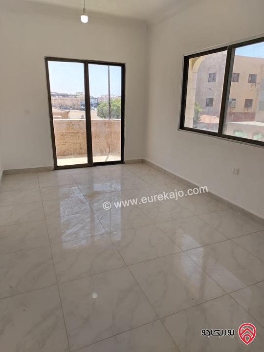 شقة طابق أول مساحة 100م للبيع في العقبة بسعر مميز 