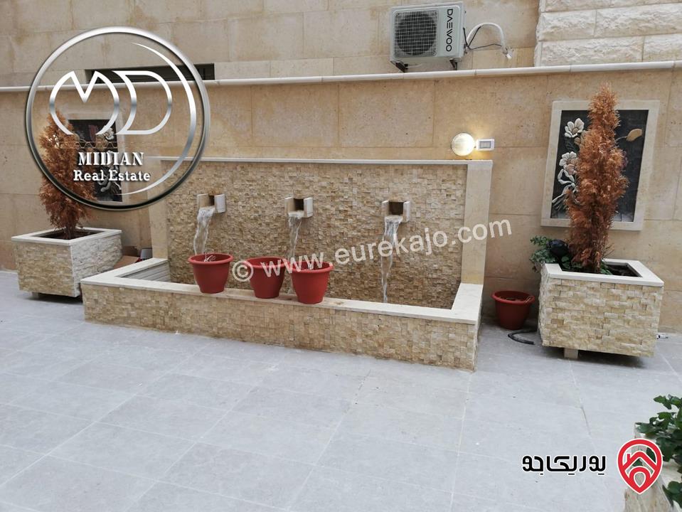 شقة ارضية مفروشة للايجار في عمان - ام السماق مساحة 130م مع ترس 100م تشطيبات و فرش سوبر ديلوكس