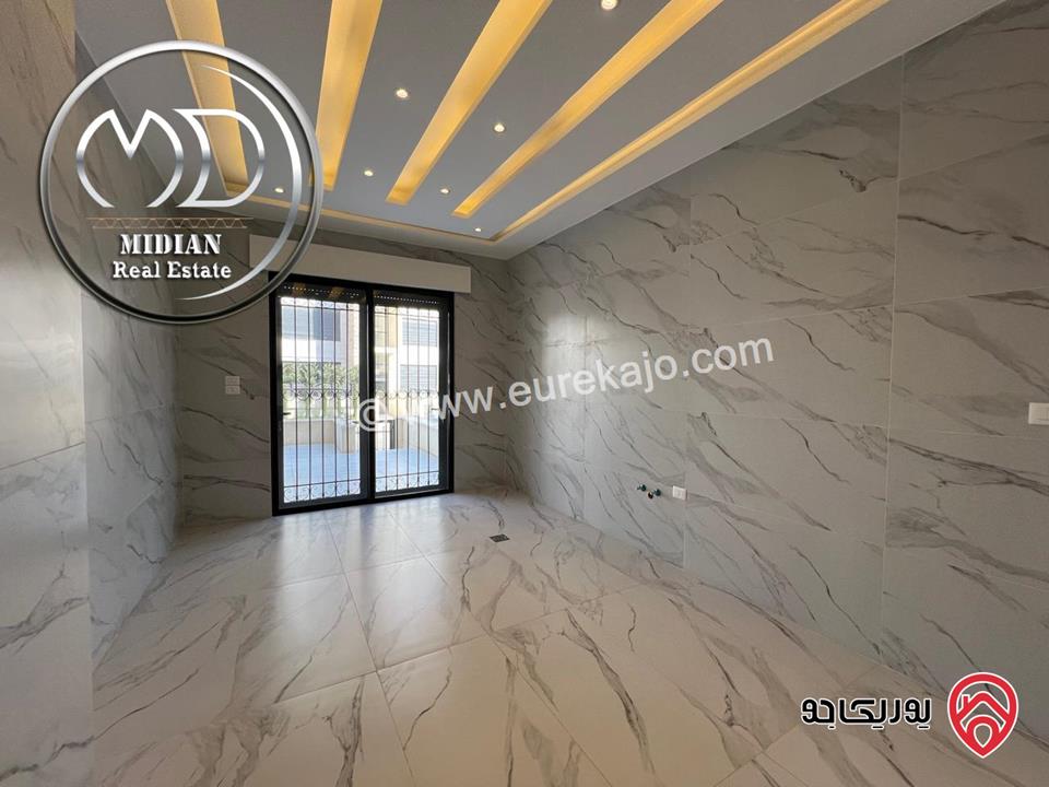 شقة ارضية جديدة للبيع في عمان - حي الصحابة مساحة 185م مع ترس و حديقة 150م تشطيبات ديكورات فاخرة و بسعر مميز