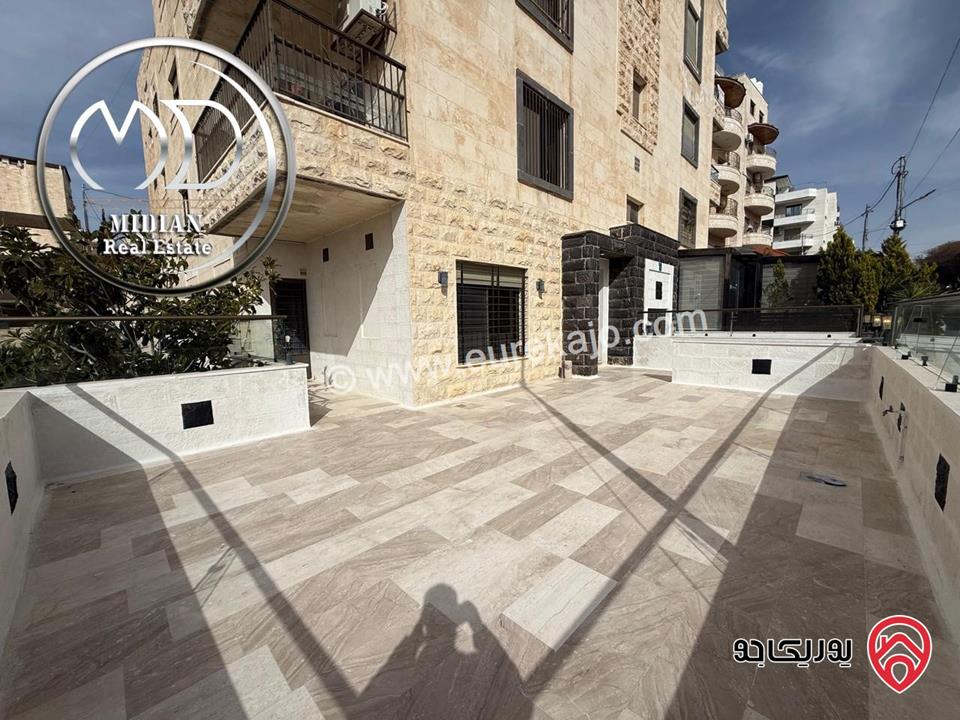 شقة ارضية للبيع في عمان - دير غبار مساحة 200م مع ترس 80م تشطيبات و ديكورات سوبر ديلوكس