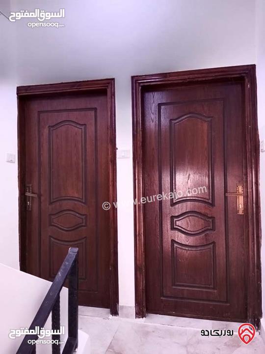 عمارة مكونة من طابقين و شقتين طابق أول مساحة كل شقة 110م للبيع في عمان - الوحدات شارع مادبا