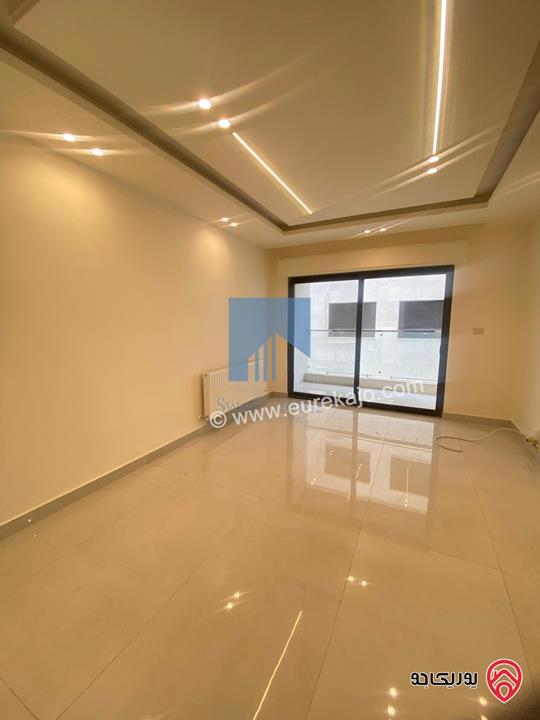 شقة أرضية فاخرة طابق ارضي معلق 90م تشطيب سوبر ديلوكس لم تسكن للبيع في عمان - أم أذينة