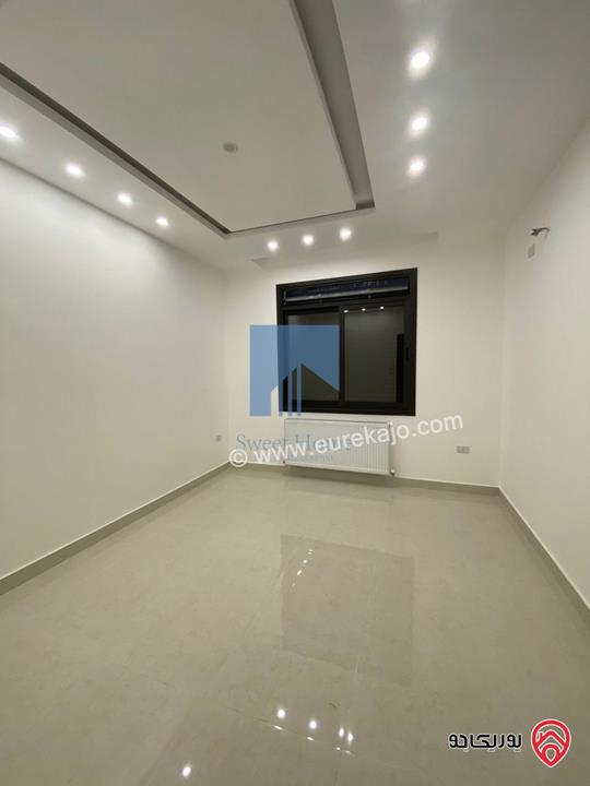 شقة أرضية فاخرة للبيع في عمان - الجندويل قرب المتصرفية 170م مع ترس 50م لم تسكن بسعر مغري