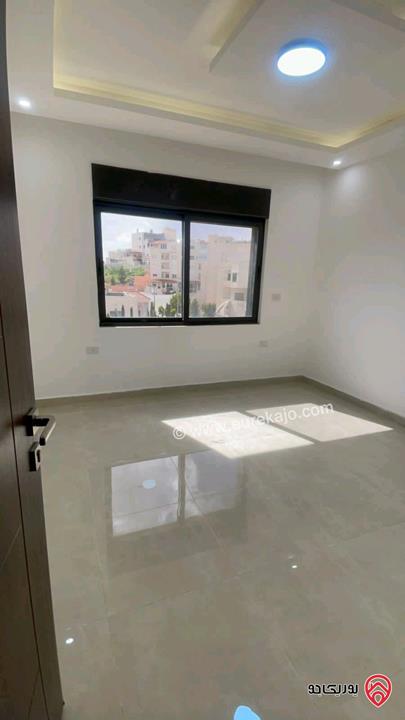 شقة جديدة طابق اول مساحة 140متر للإيجار في عمان - مرج الحمام 