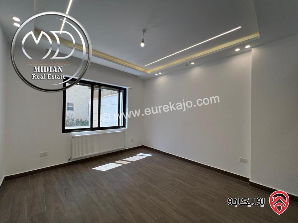 شقة ارضية جديدة للبيع في عمان - ضاحية النخيل مساحة 185م مع ترس 50م تشطيبات ديكورات فاخرة بسعر مميز