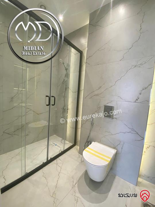 شقة دوبلكس جديدة طابق اخير مع روف للبيع في عمان - الجندويل مساحة 230م مع تراسات تشطيبات ديكورات عصرية اطلالة جميلة