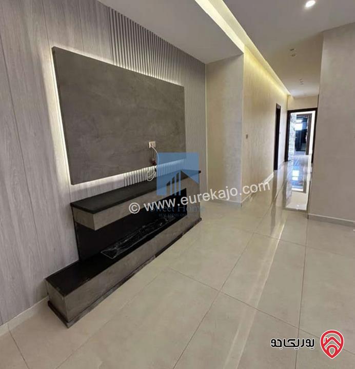 شقة أرضية فاخرة للبيع في عمان - تلاع العلي - خلف طواحين الهوا 180م مع ترس 40م لم تسكن