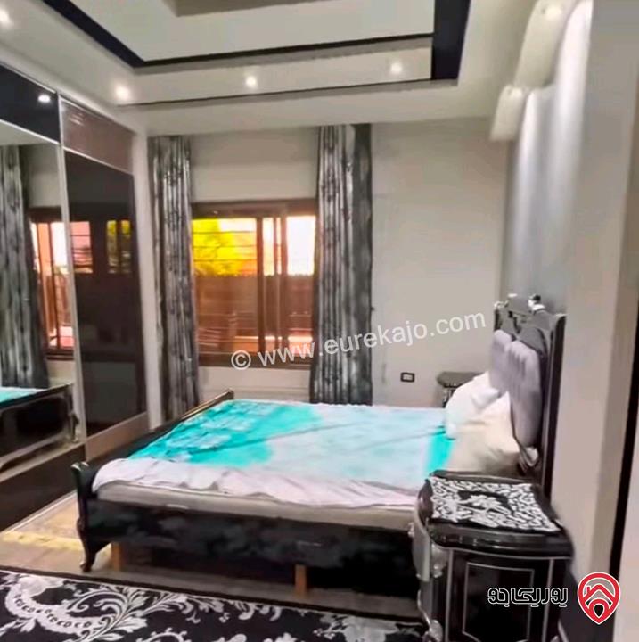 شقة ارضية مفروشة مساحة 135م داخلي و 50م خارجي للبيع في عمان - الرابية مخدومة ومنطقة هادئة