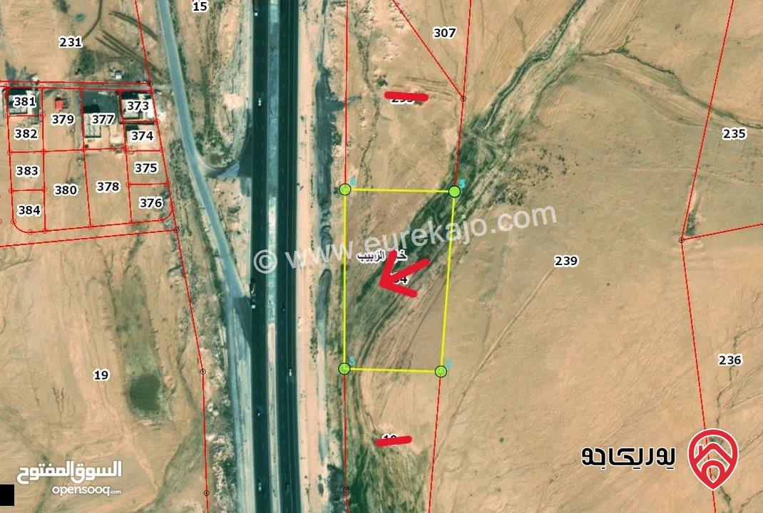 قطعة ارض مساحة 9 دونم و 329م للبيع من اراضي جنوب عمان - خان الزبيب واجهه 128م على الطريق الصحراوي موقع استثماري مميز يصلح لكافة الاستثمارات 