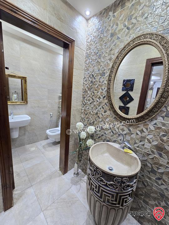 شقة ارضية مساحة 131م مع تراس 50م ومدخل خاص للبيع في عمان - الرابية 