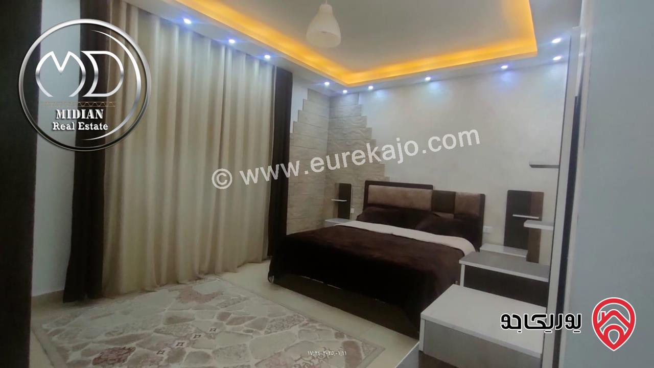 شقة ارضية مفروشة للايجار في عمان - ام السماق مساحة 130م مع ترس 100م تشطيبات و فرش سوبر ديلوكس