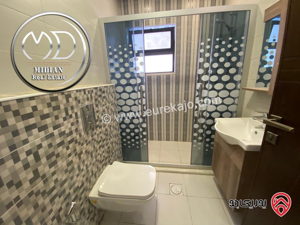 شقة شبه ارضي جديدة للبيع في عمان - طريق المطار مساحة 175م مع ترس و حديقة 100م إمكانية الأقساط بسعر مميز جداً