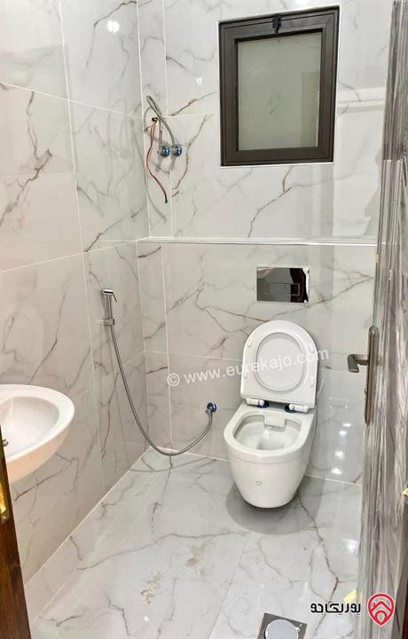 شقة ارضية مساحة 145م داخلي و 25م خارجي للبيع في عمان - ابو علندا اسكان الكهربا 