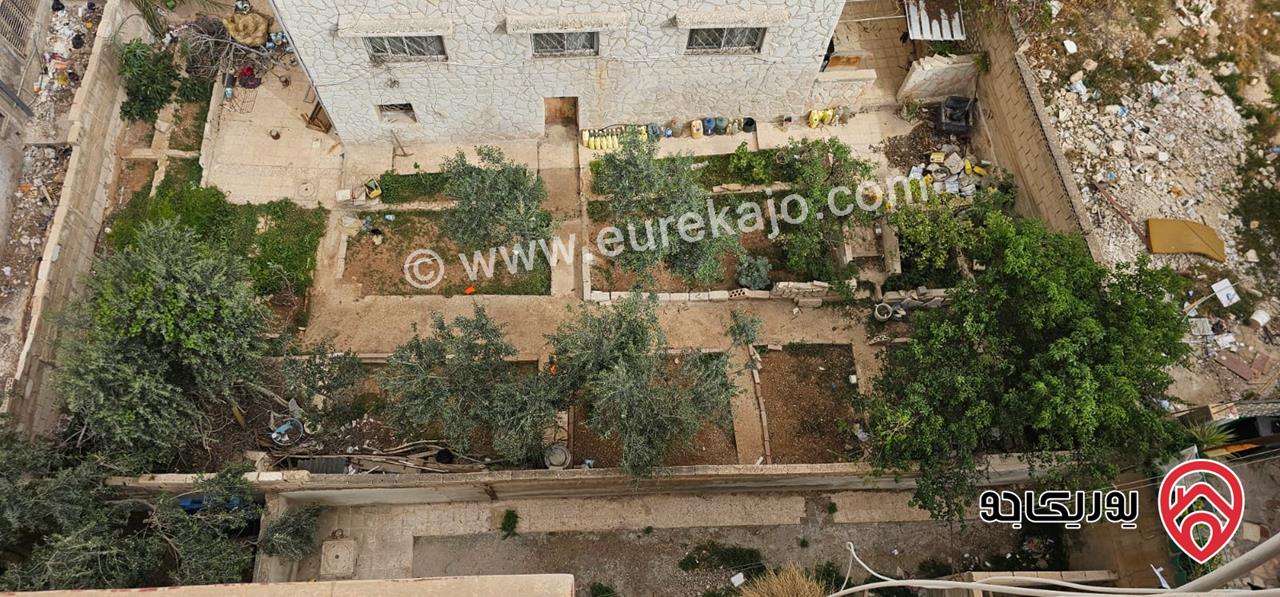 عمارة على أرض 455م للبيع في الزرقاء - حي الإسكان 