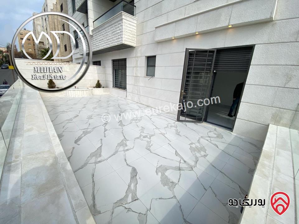 شقة أرضية للبيع في عمان - الرابية مساحة 220م مع ترس و حديقة 200م تشطيبات ديكورات سوبر ديلوكس جديدة لم يسكن