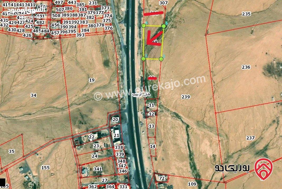 قطعة ارض مساحة 9 دونم و 329م للبيع من اراضي جنوب عمان - خان الزبيب واجهه 128م على الطريق الصحراوي موقع استثماري مميز يصلح لكافة الاستثمارات 