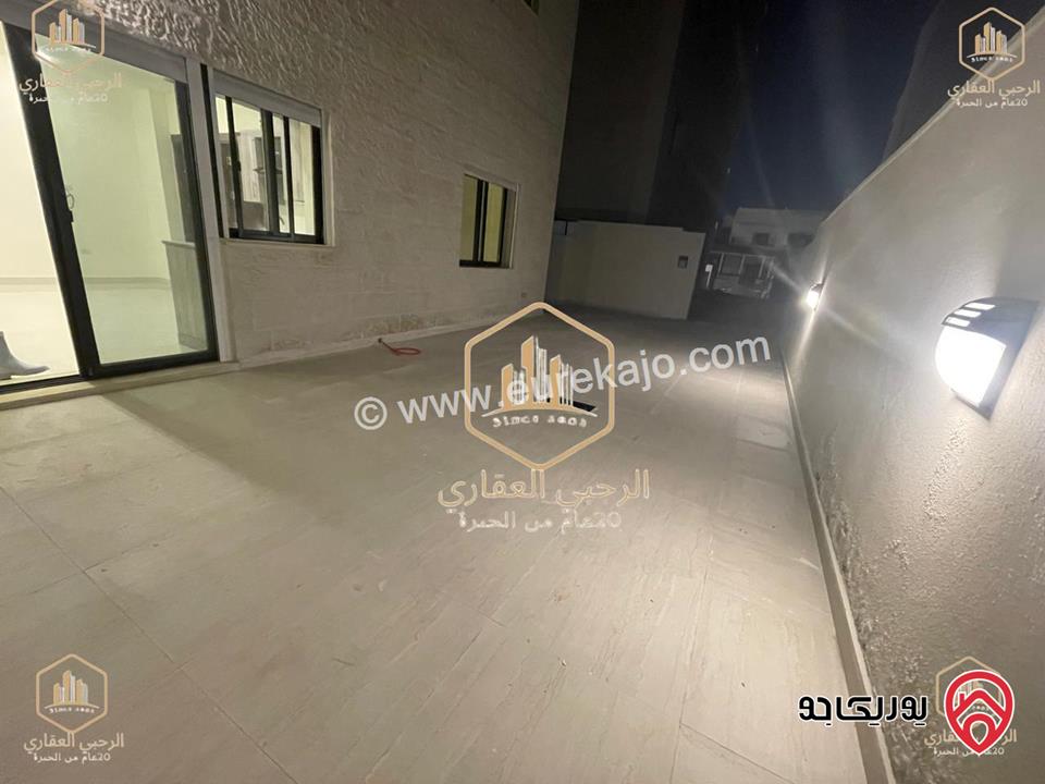 شقة ديلوكس شبه ارضية مساحة 90م مع ترس 50م للايجار في عمان - الجندويل 