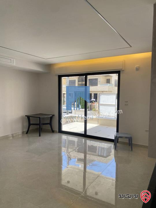 شقة أرضية فاخرة للبيع في عمان - أم أذينة قرب أبراج السادس 200م مع ترس 60م لم تسكن