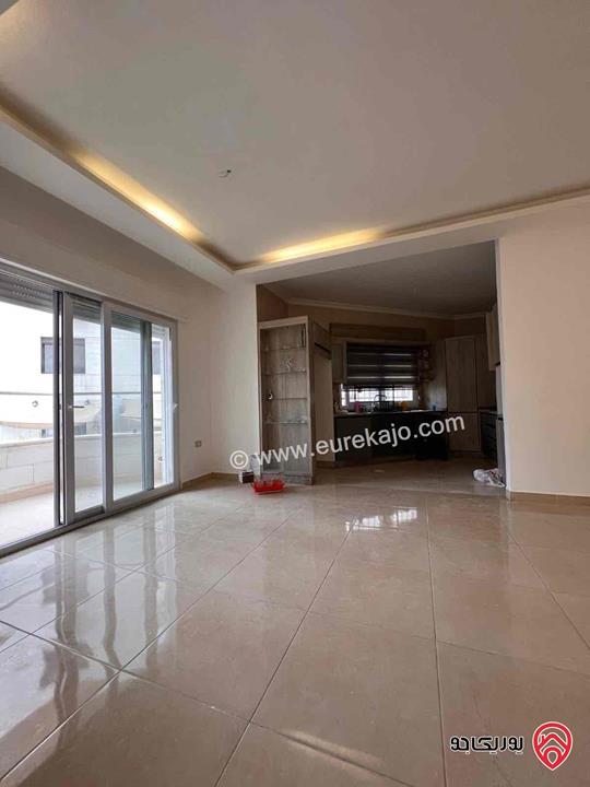 شقة شبه ارضية مساحة 110م للايجار في عمان - خلدا