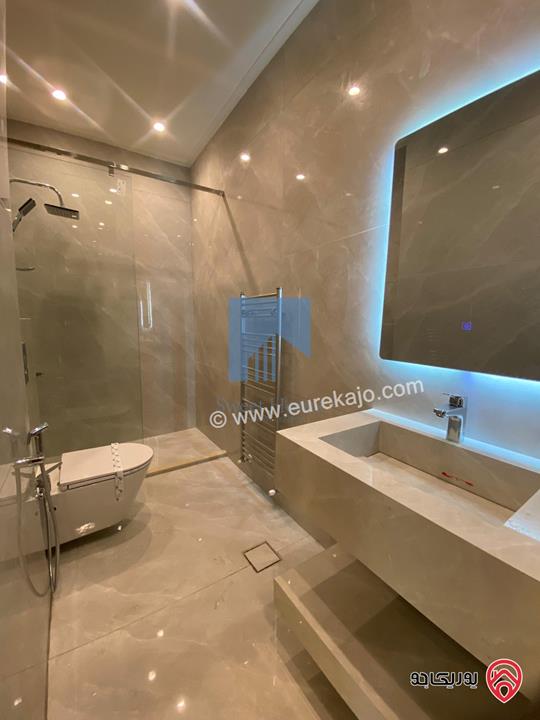 شقة أرضية فاخرة طابق ارضي معلق 90م تشطيب سوبر ديلوكس لم تسكن للبيع في عمان - أم أذينة