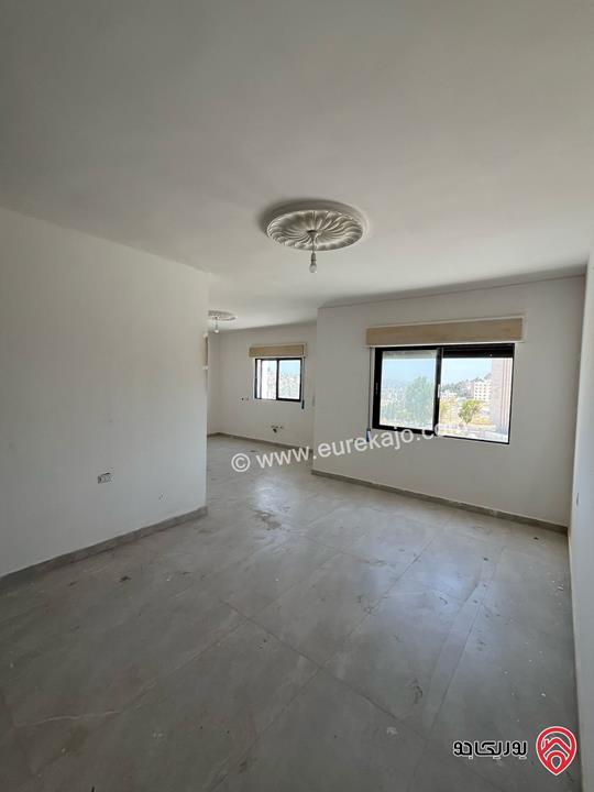 شقة طابق أول مساحة 100م للبيع في عمان - جبل الزهور