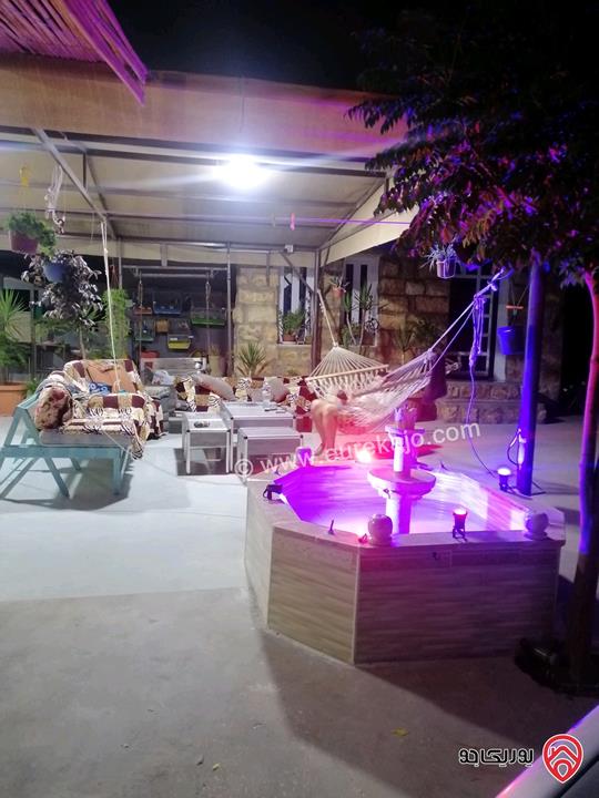 مزرعة ومنتجع مساحة الأرض 3 دونم و 700م والبناء 250م للبيع في اربد - كفر سوم قوشان مستقل استثمارية وسكنية