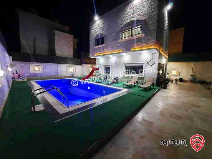شاليه مساحة الأرض 324م مع بناء 90م وبركة سباحة للبيع في منطقة الكرامة الاغوار الجنوبية