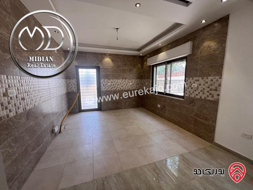 شقة ارضية جديدة فارغة للايجار في عمان - ضاحية الرشيد مساحة 150م مع ترس 50م تشطيبات سوبر ديلوكس بسعر مميز