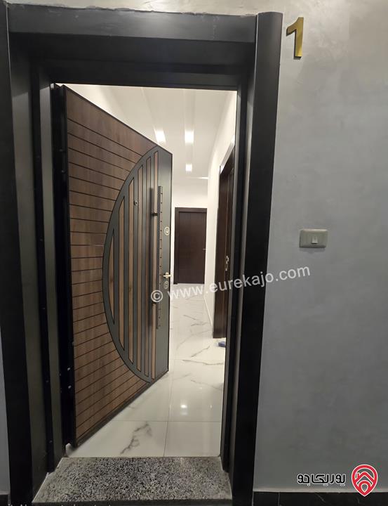 شقة ديلوكس شبه أرضية / تسوية مساحة 140م وترس 35م للبيع في عمان - البنيات الجنوبي طريق المطار 