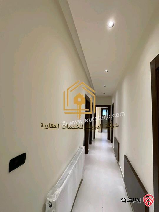 شقة جديدة طابق أرضي مساحة 165م داخلي و 180م خارجي للايجار في عمان - حي الصحابة 