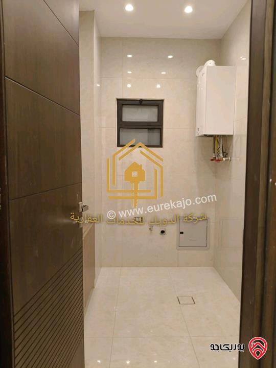 شقة جديدة لم تسكن أرضي مساحة 180م مع ترس 70م للإيجار في عمان - طريق المطار 