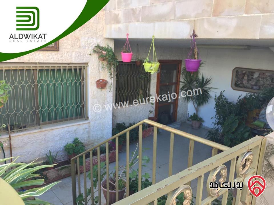 شقة شبة ارضية للبيع في عمان - المدينة الرياضية مساحة البناء 244 م مساحة الترس 30 م