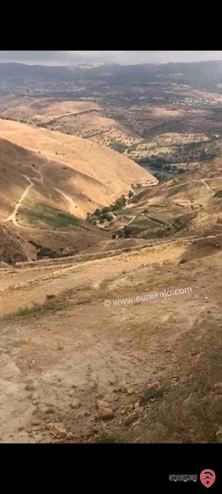 قطعة أرض مميزة ومطلة مساحة 12 دونم و 344م للبيع من أراضي شمال عمان - شارع الأردن على سد الملك طلال