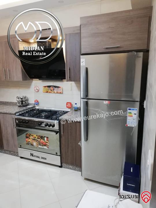 شقة ارضية مفروشة للايجار في عمان - ام السماق مساحة 130م مع ترس 100م تشطيبات و فرش سوبر ديلوكس