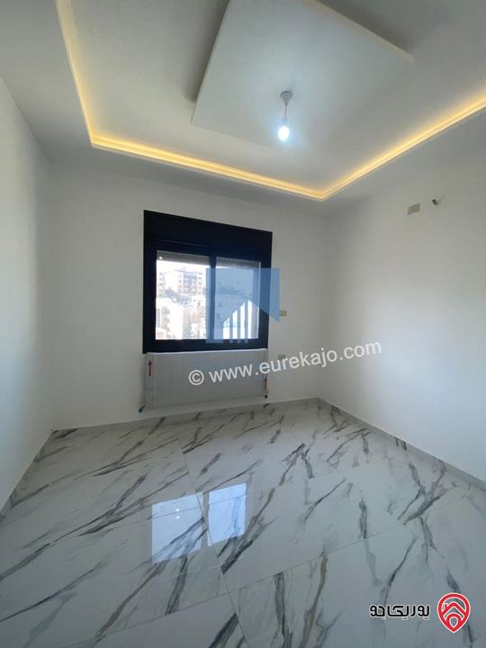 شقة فاخرة شبه أرضية مساحة 160م مع ترس 25م تشطيب سوبر ديلوكس للبيع في عمان - تلاع العلي