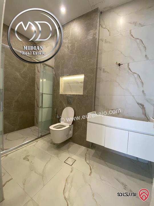 شقة شبه أرضي جديدة للبيع في عمان - خلدا مساحة 265م 4 نوم مع ترس و حديقة 250م تشطيبات و ديكورات عصرية فاخرة