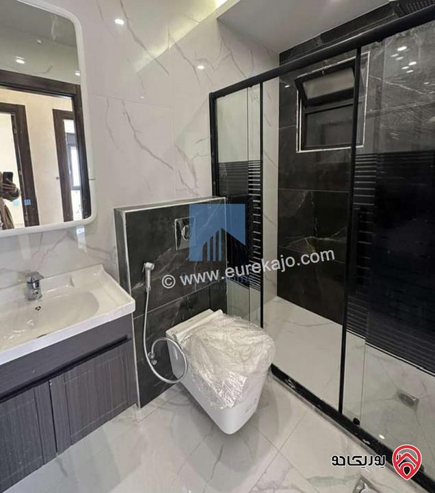 شقة أرضية فاخرة للبيع في عمان - تلاع العلي - خلف طواحين الهوا 180م مع ترس 40م لم تسكن