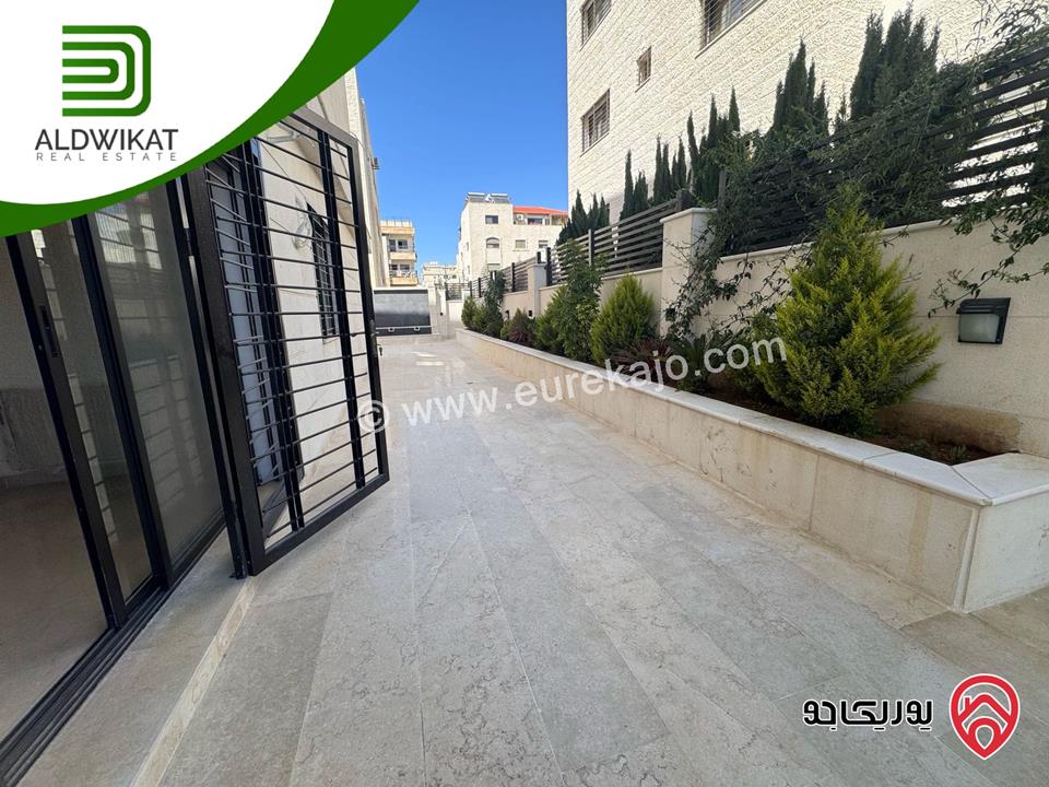 شقة ارضية للبيع في عمان - رجم عميش / طريق المطار مساحة البناء 210م ومساحة الحديقة 200م