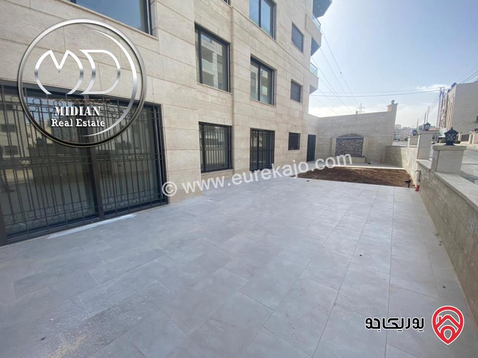 شقة ارضية جديدة للبيع في عمان - ضاحية النخيل مساحة 250م مع ترس و حديقة 150م تشطيبات و ديكورات سوبر ديلوكس