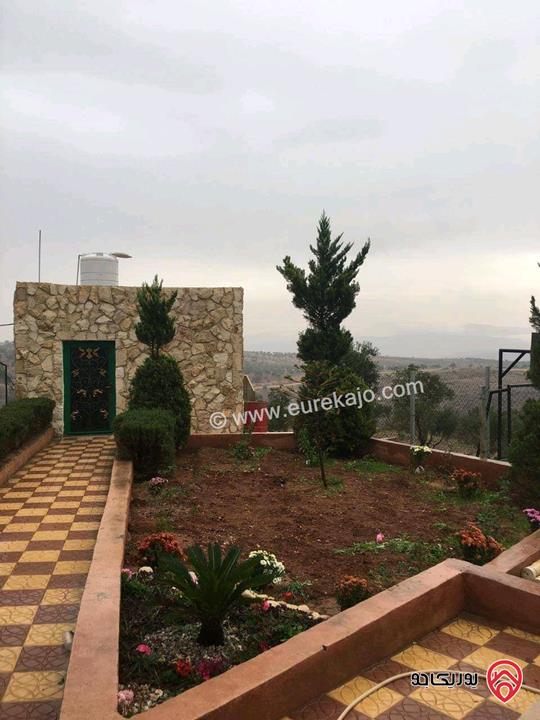 مزرعة مع شاليه ريفي مساحة الأرض 11 دونم والبناء 216م للبيع في جرش - بمنطقة الفوارة قضاء برما 