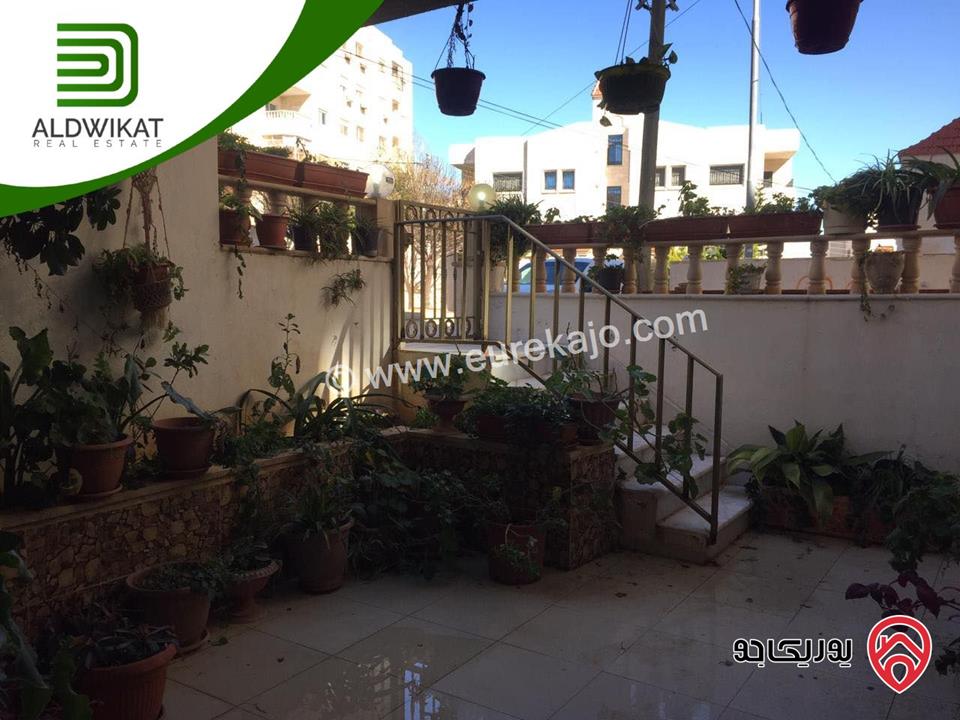 شقة شبة ارضية للبيع في عمان - المدينة الرياضية مساحة البناء 244 م مساحة الترس 30 م