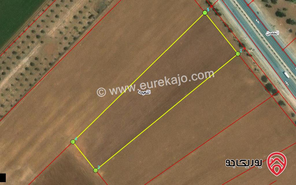 قطعة ارض تجارية مساحة 7969م للبيع في اربد على شارع اربد عمان مباشرة   