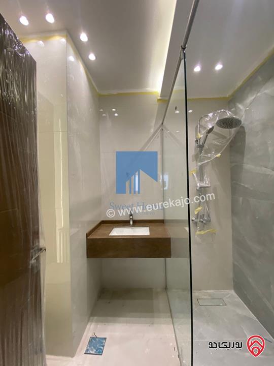 شقة أرضية فاخرة للبيع في عمان خلدا - قرب إشارة البنك العربي 175م مع ترسات 200م لم تسكن