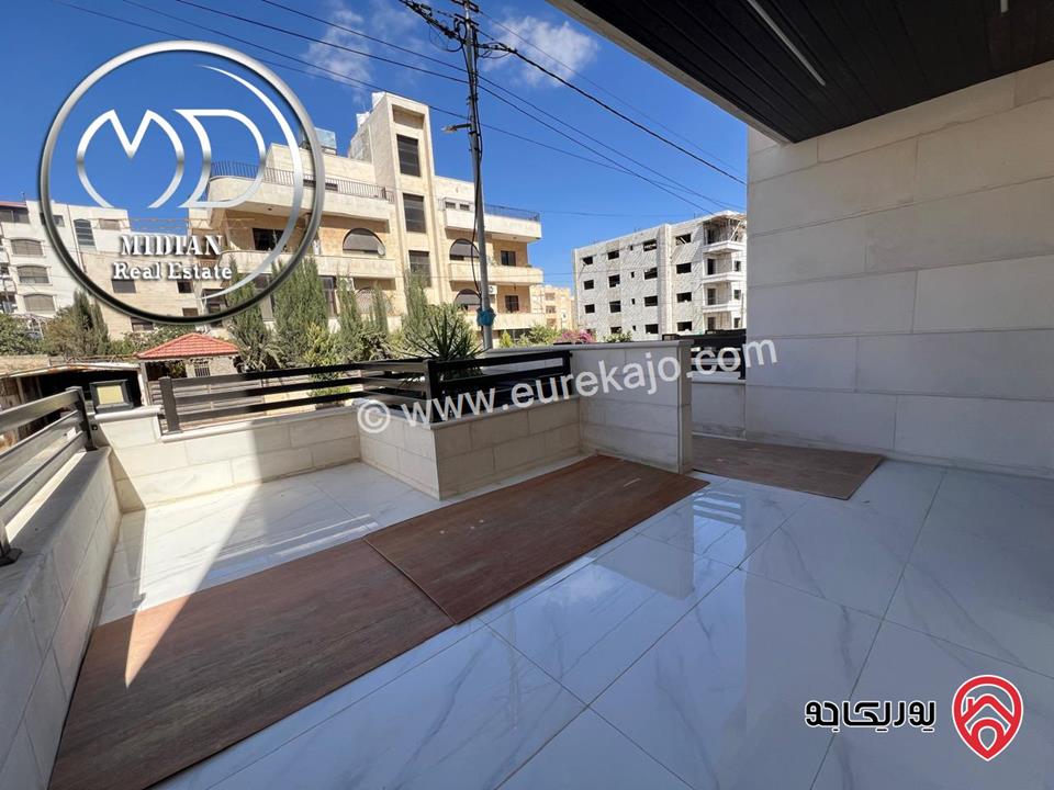 شقة ارضية جديدة للبيع في عمان - ضاحية الرشيد مساحة 185م مع ترس 40م تشطيبات ديكورات سوبر ديلوكس بسعر مميز جداً