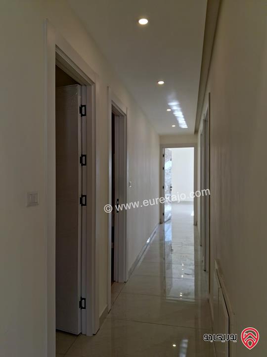 شقة جديدة طابق أول مساحة 175م للبيع في عمان - الرابية