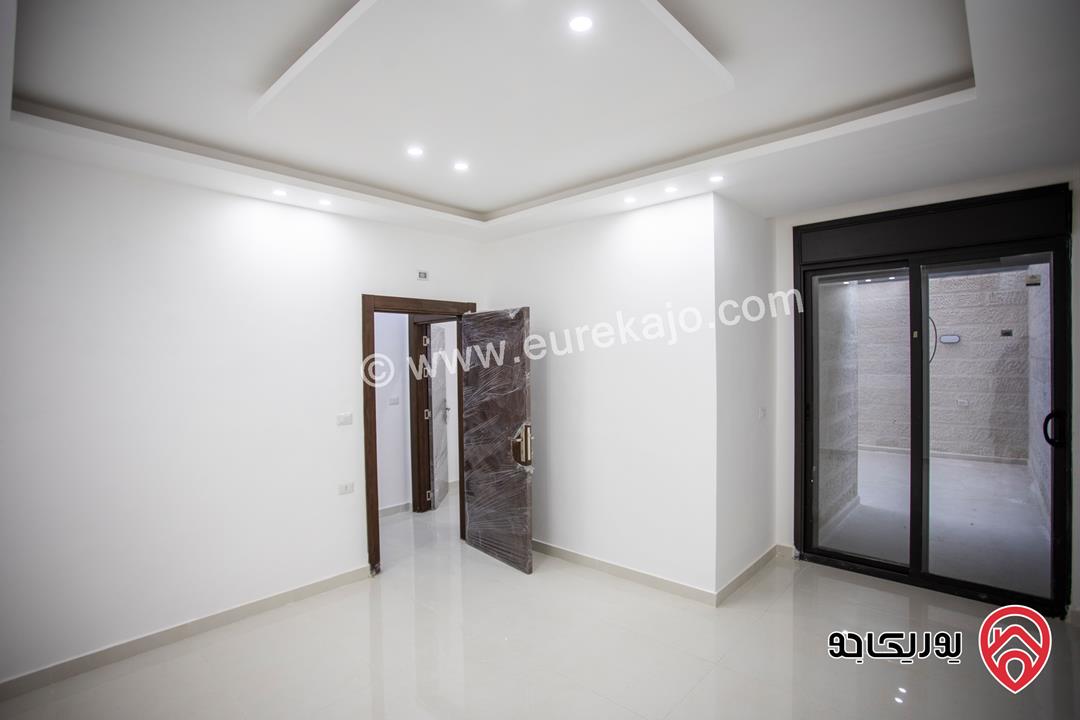 شقة فاخرة أرضية مساحة 120م مع ترس امامي و ترس خلفي للبيع في عمان - ابو علندا من المالك 