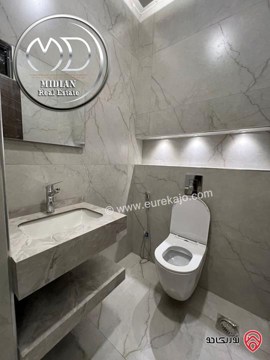 شقة شبه ارضي جديدة للبيع في عمان - ضاحية الرشيد مساحة 225م مع ترس 100م تشطيبات سوبر ديلوكس بسعر مميز 