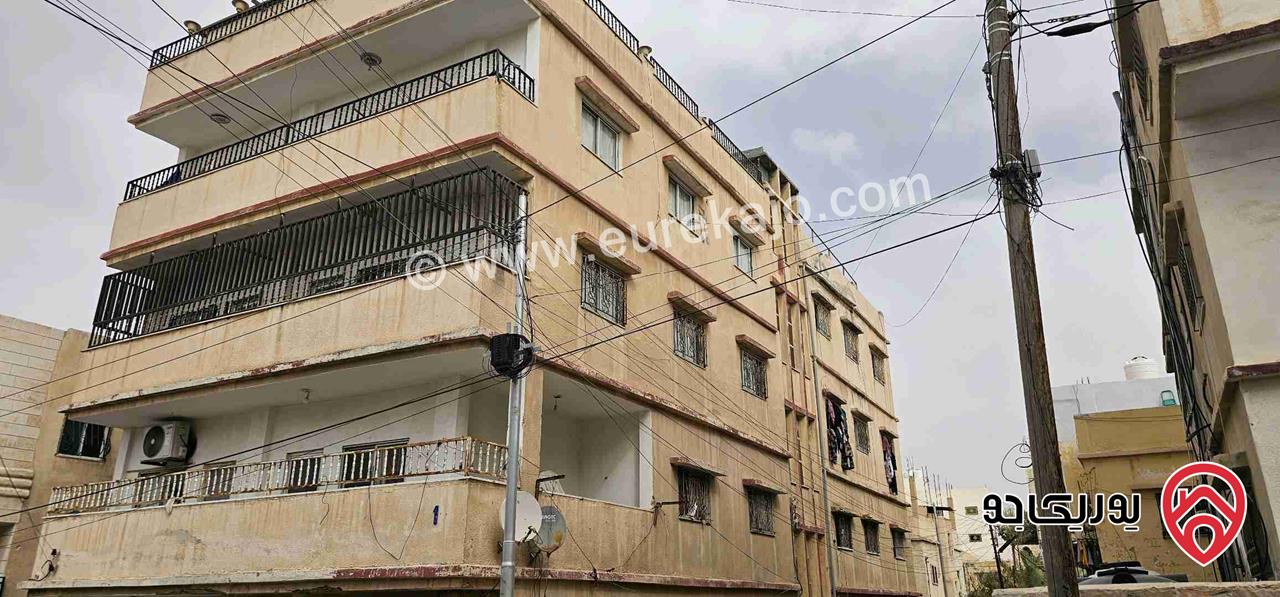 عمارة على أرض 455م للبيع في الزرقاء - حي الإسكان 