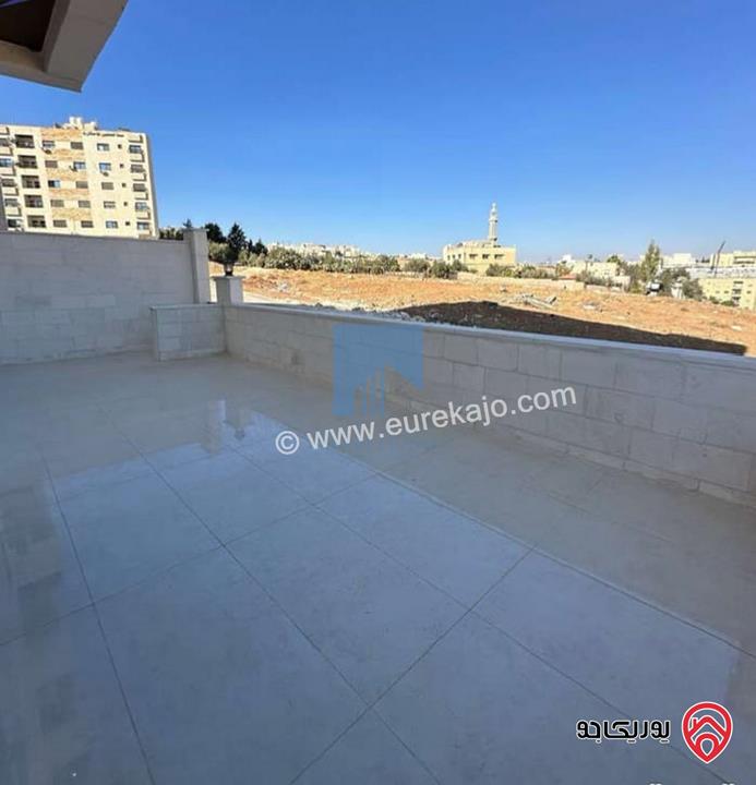 شقة أرضية فاخرة للبيع في عمان - تلاع العلي - خلف طواحين الهوا 180م مع ترس 40م لم تسكن