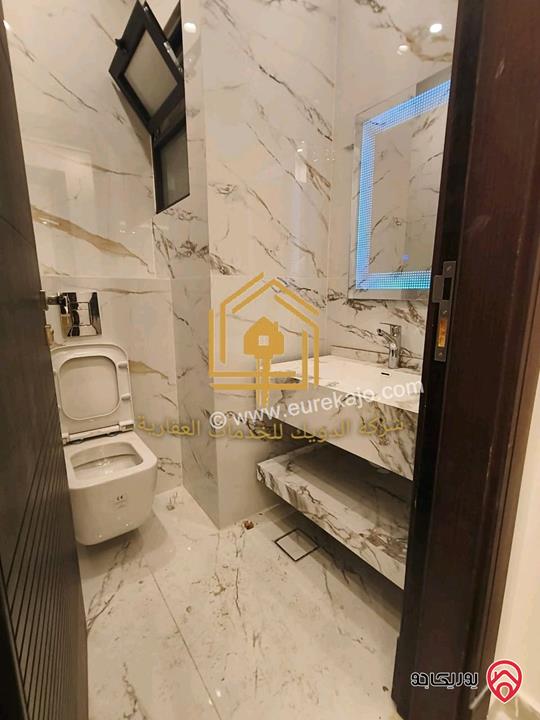 شقة جديدة لم تسكن أرضي مساحة 180م مع ترس 70م للإيجار في عمان - طريق المطار 